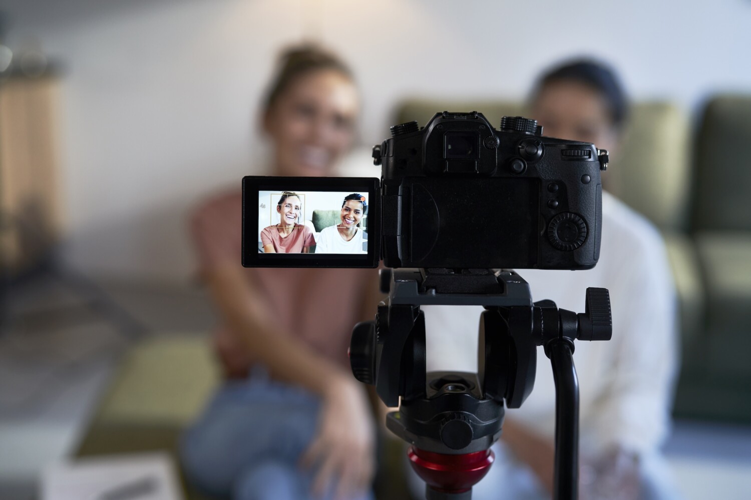 Selective focus on two female vloggers recording a movie